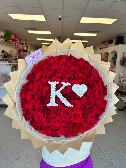 70 roses with letter filled with baby breath